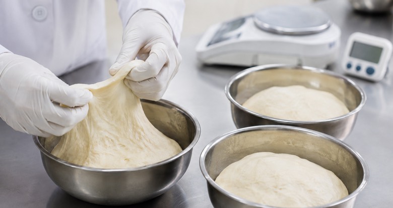 Matched bakery dough samples compared for water absorption and handling in a controlled trial
