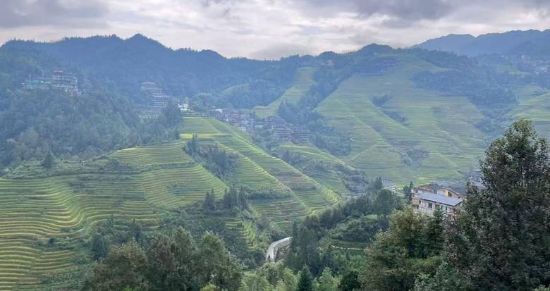 Longji Rice Terraces near Guilin with layered green fields and mountain villages