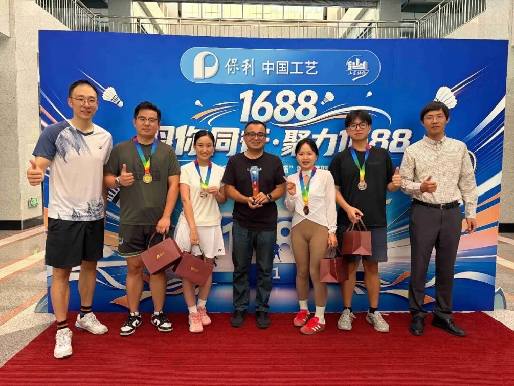 SINOCMC badminton team with medals and trophy after winning third prize